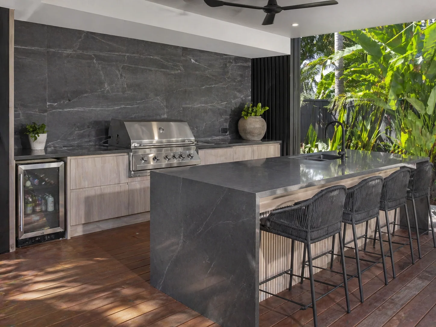 Premium outdoor kitchen with dark marble waterfall island — Townsville